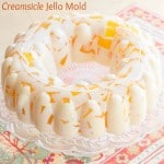 Creamsicle Jello Mold - cubes of fresh orange jello "floating" in vanilla ice cream gelatin for a fresh and creamy, fun retro dessert! | cupcakesandkalechips.com | gluten free