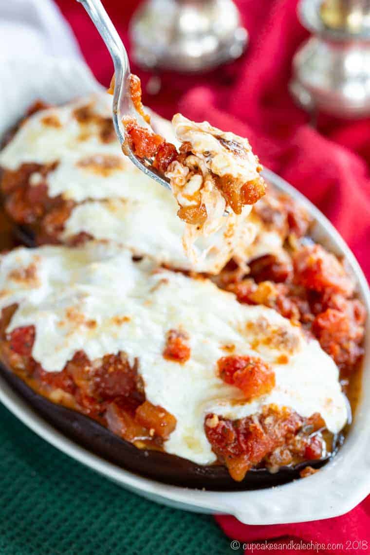 A fork with Mozzarella Ricotta Cheese Stuffed Eggplant Parmesan