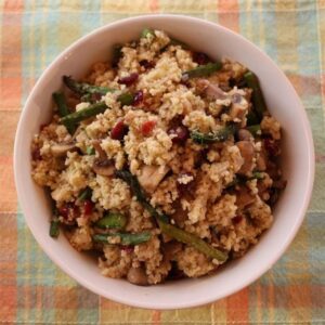 Millet, a healthy and gluten free cereal, pairs perfectly with oven-roasted asparagus and sauteed mushrooms to make roasted asparagus mushroom millet pilaf. | CupcakesAndKaleChips.com