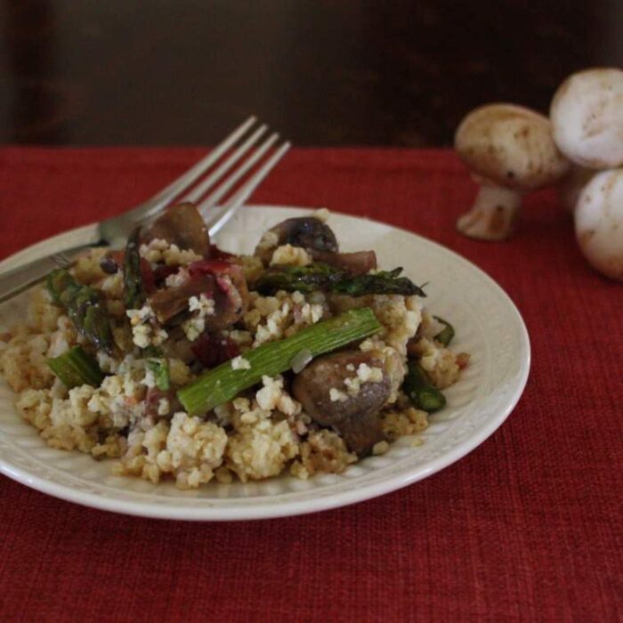 Roasted Asparagus and Mushroom Millet Pilaf on a white plate.
