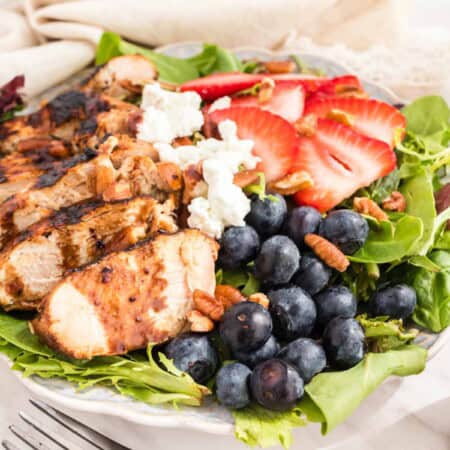 Mixed greens topped with grilled chicken, blueberries, strawberries, goat cheese, pecans, and blueberry balsamic vinaigrette