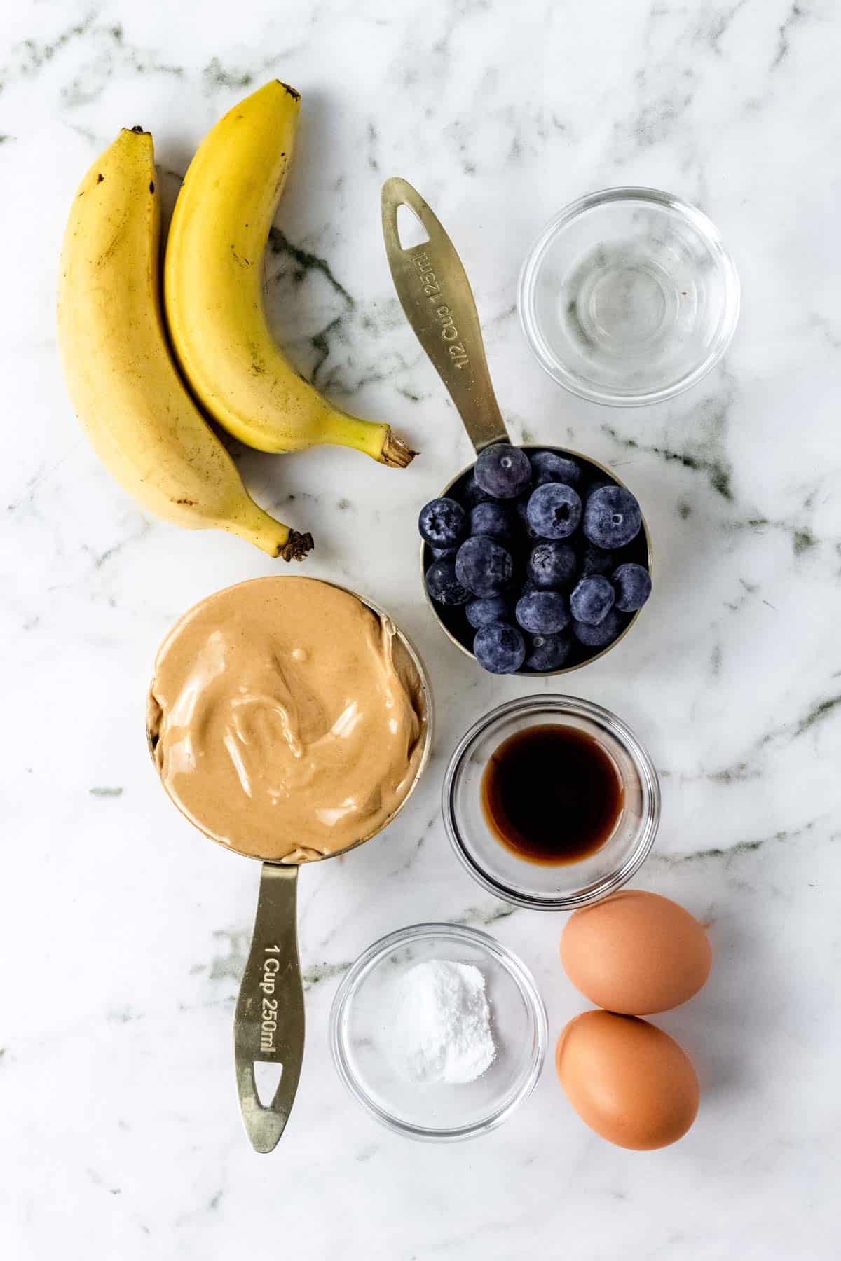 The ingredients for flourless blueberry mini muffins.