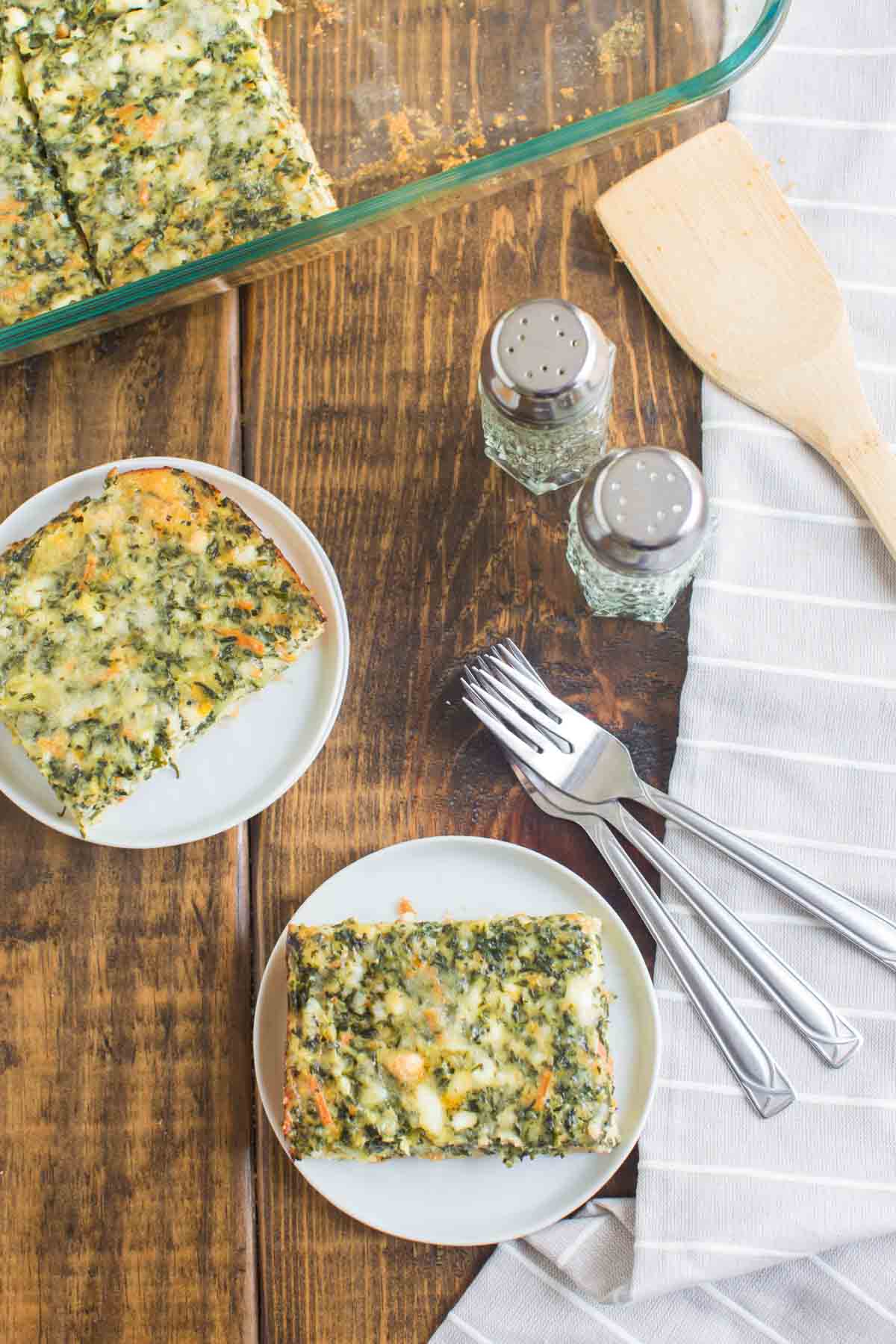 Vegetarian Breakfast Casserole served on plates for breakfast with forks next to them.