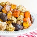 Balsamic Roasted Vegetables in a white bowl with a decorative embossed rim.