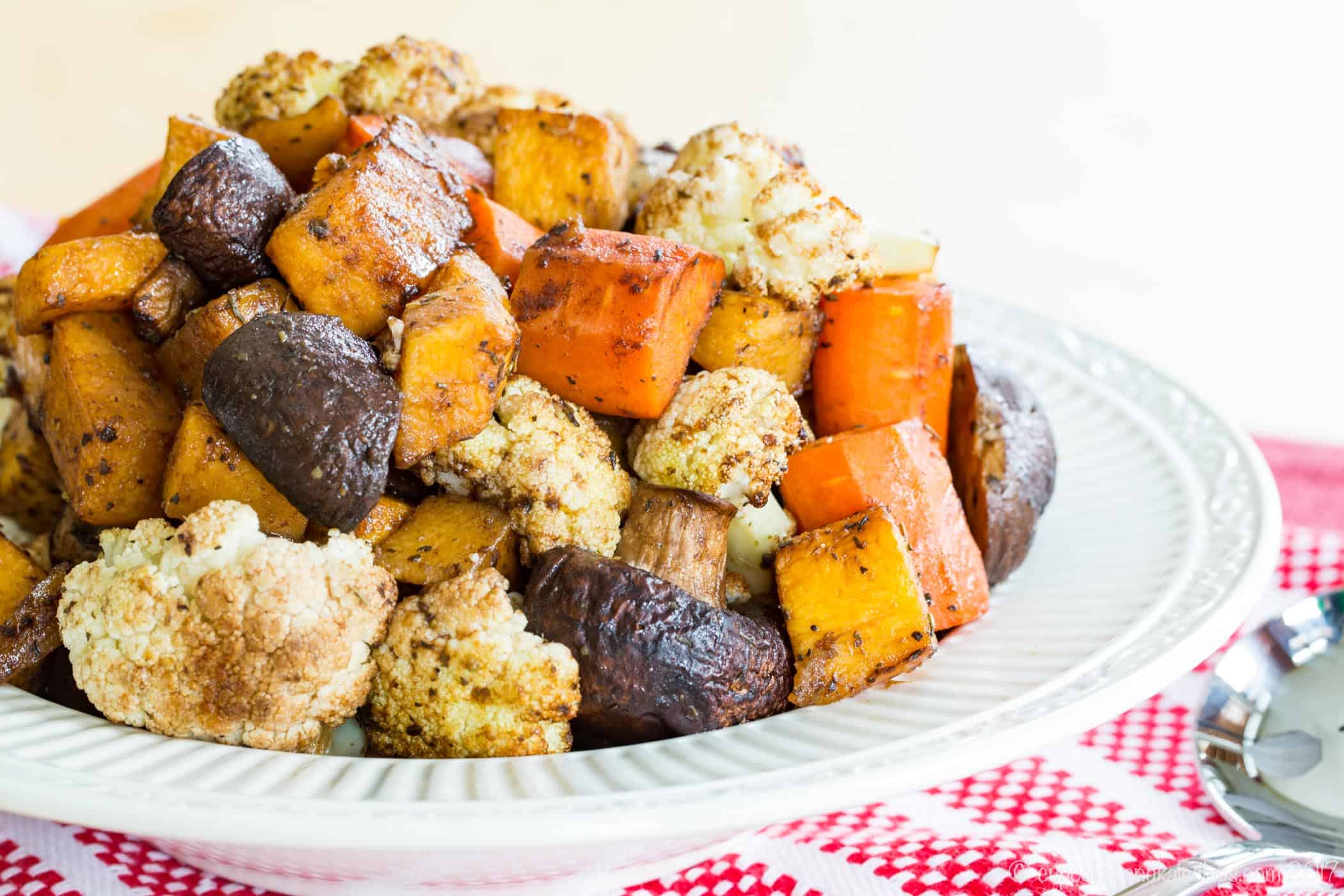 Balsamic Roasted Vegetables in a white bowl with a decorative embossed rim.