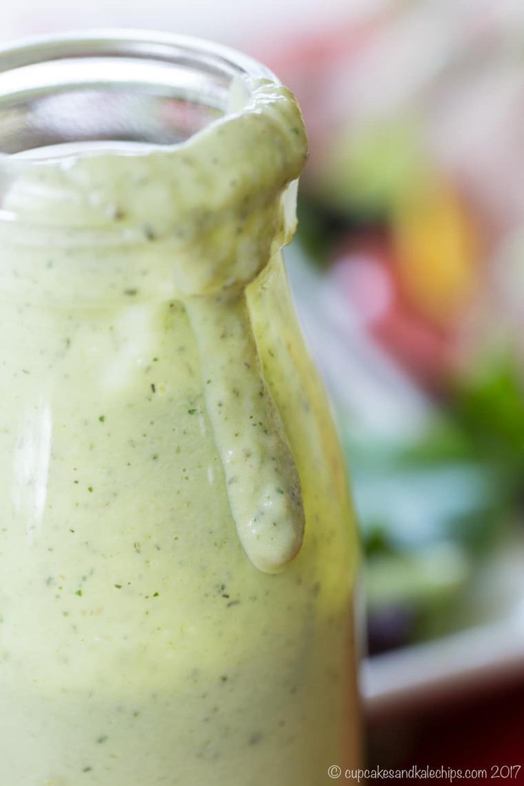 Avocado Buttermilk Ranch Dressing dripping over the edge of the bottle