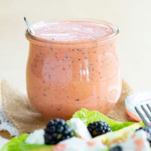 Strawberry Lime Poppy Seed Salad Dressing in a glass Weck jar.