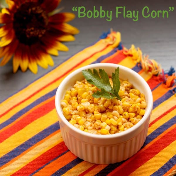 Chili lime corn kernels in a ramekin garnished with cilantro.