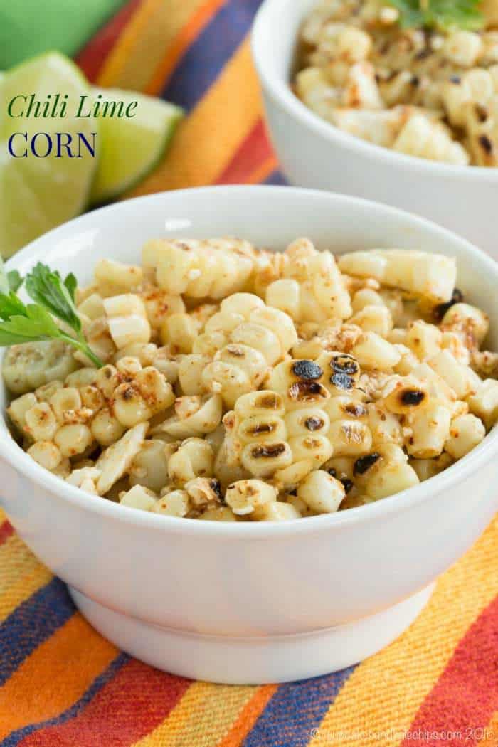 A bowl of charred corn kernels garnished with cilantro.