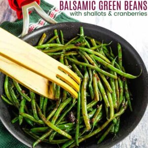 Balsamic Shallot Green Beans in a Skillet being picked up with wooden tongs