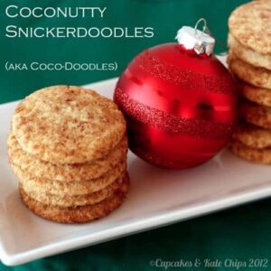 Plate of coconut snickerdoodles with a red Christmas ball ornament.