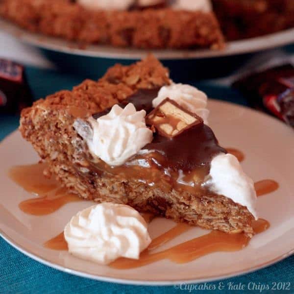 Monster Snickers Pie - a giant monster cookie crust and layers of caramel, peanuts, and chocolate ganache, this is the ultimate dessert recipe! | cupcakesandkalechips.com | gluten free