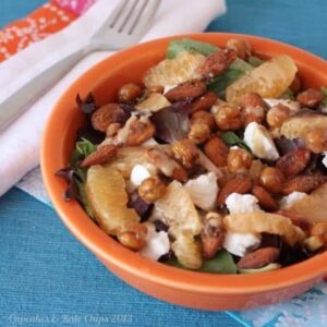 Orange roasted chickpeas, creamy goat cheese, and spiced almonds are a delicious combination in this quick and easy-to-make dinner salad. | Cupcakesandkalechips.com