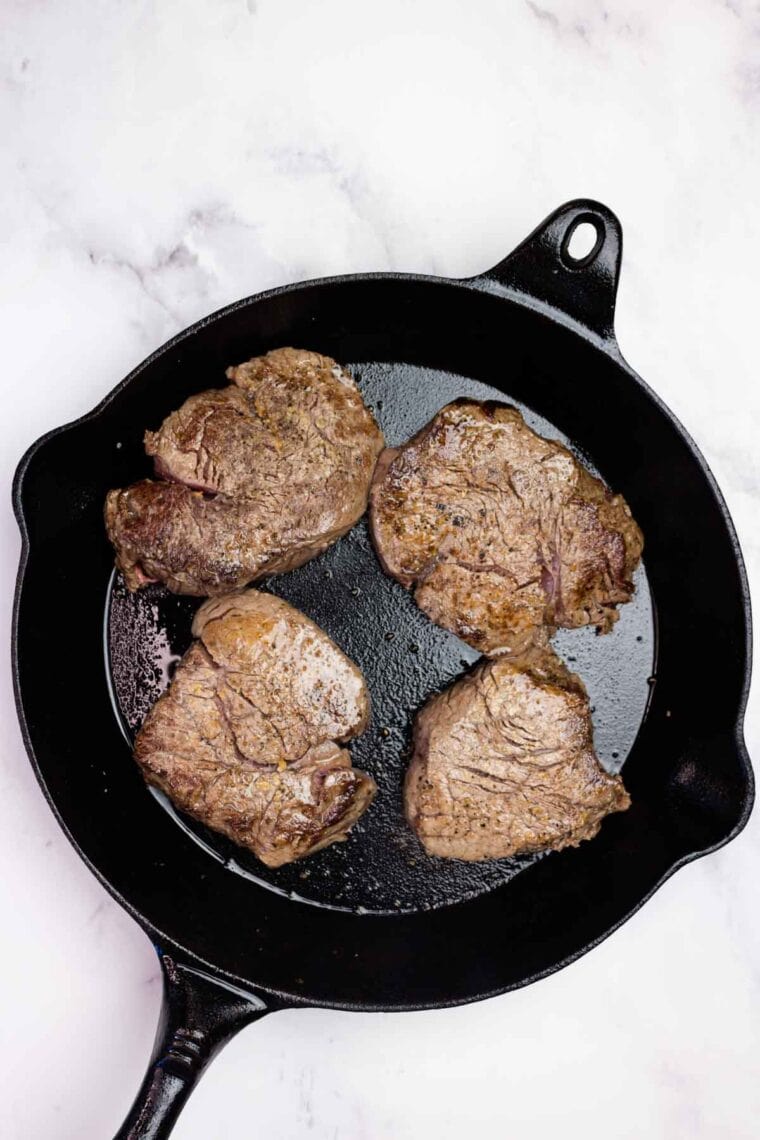 Seared filet mignon in a cast iron skillet