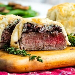 An Individual Beef Wellington cut open to show the medium rare steak inside