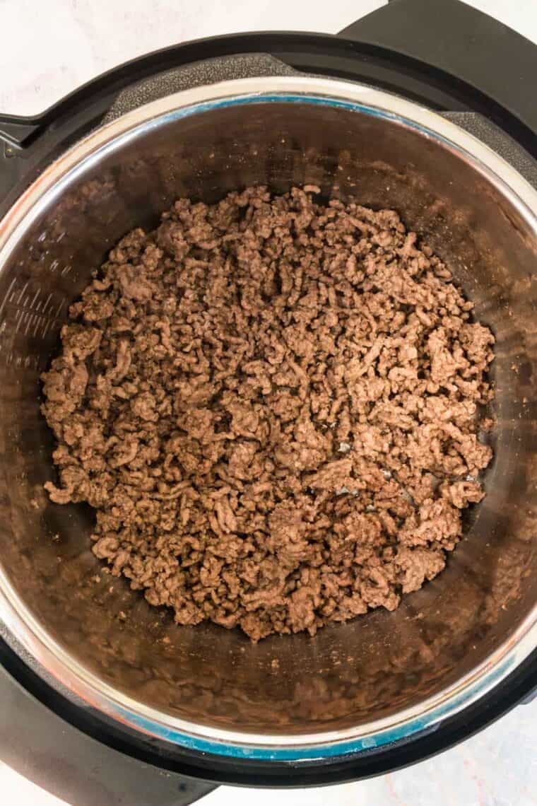 Ground beef is browned in the bowl of the Instant Pot.