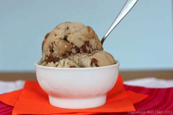 Scoops of banana Nutella swirl gelato in a white bowl with a spoon.