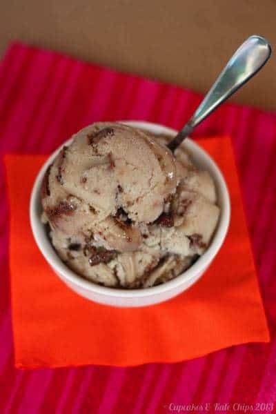 Scoops of banana Nutella swirl gelato in a white bowl with a spoon.