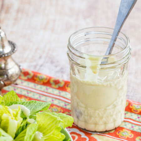 Glass mason jar with Creamy Greek Yogurt Dijon Dressing