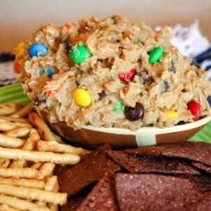 Flourless Monster Cookie Dough Dip in a bowl shaped like a football.