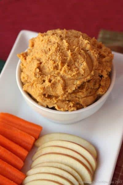 Maple Walnut Sweet Potato Hummus served with carrots and apples for dipping