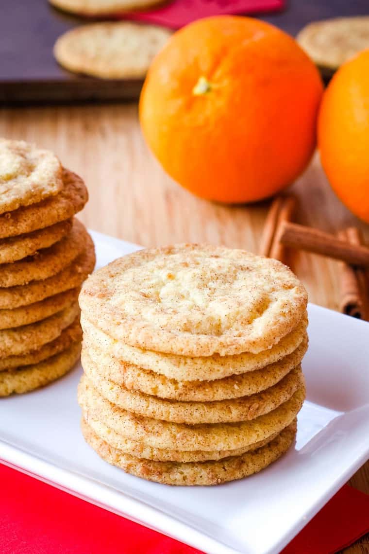 Stack of Cardamom Orange Cookies on a white rectangular plate