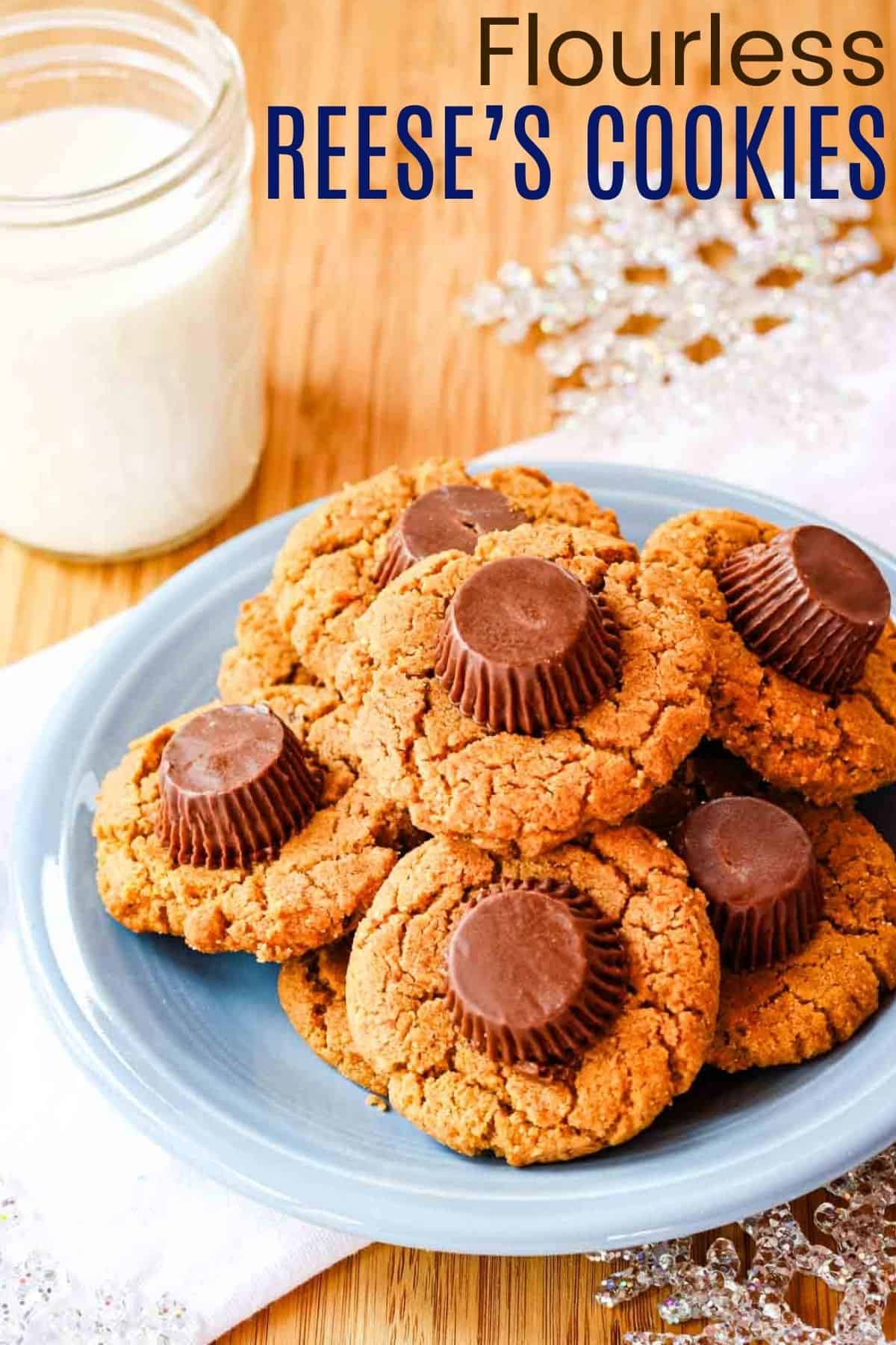 Flourless Reese's Peanut Butter Cup Cookies - this easy cookie recipe has double the peanut butter plus chocolate, and no flour making them naturally gluten free. These are always a favorite for Christmas or as a treat for the kids any day of the year. #cookies #peanutbuttercups #glutenfree