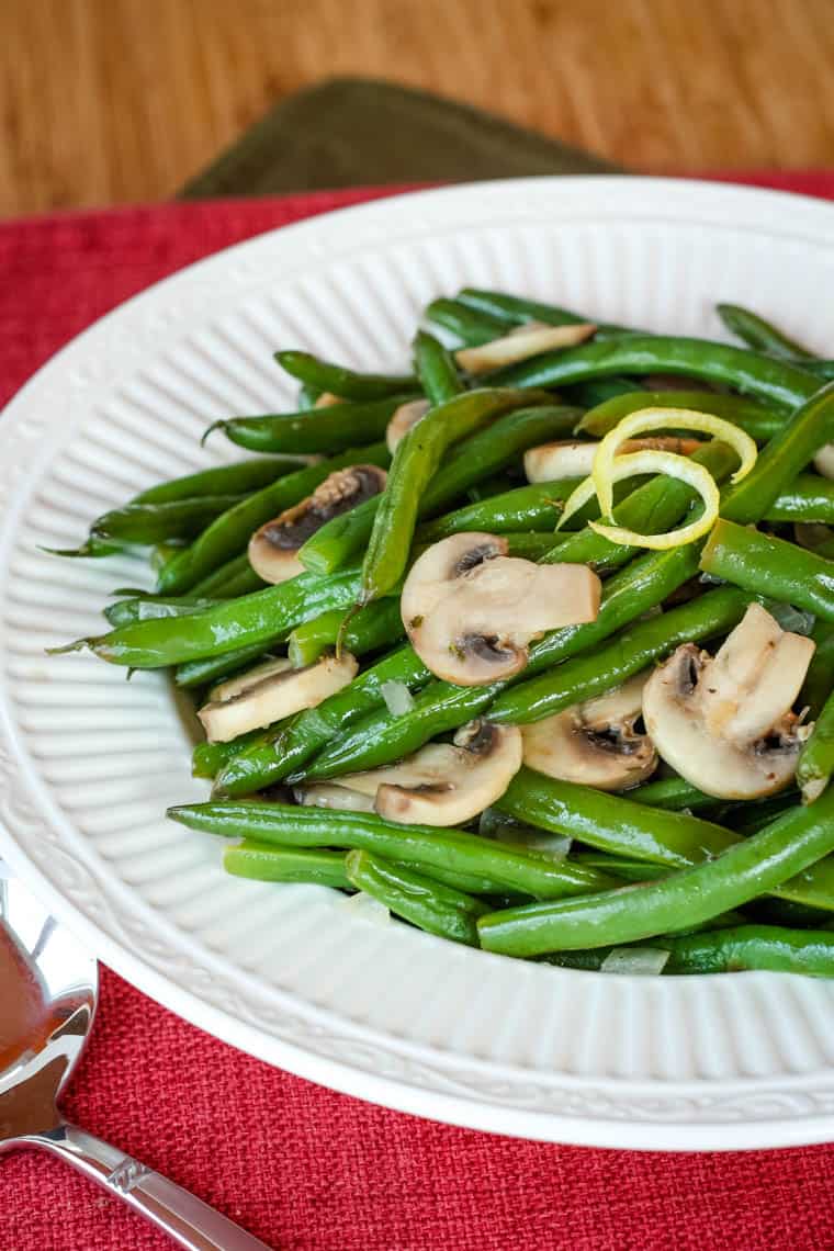 Finished green beans and mushrooms recipe in a serving bowl