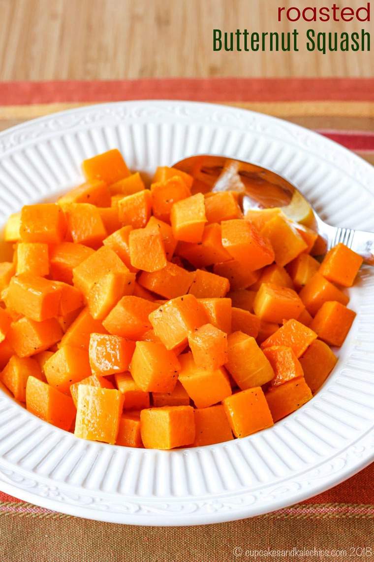 Diced roasted butternut squash in a white serving dish.