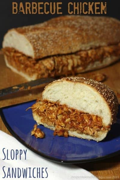 A barbecue chicken sandwich on a blue plate.