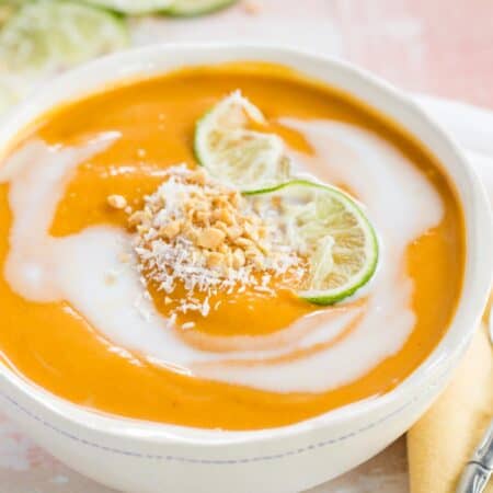 Thai Butternut Squash Soup served in a bowl with soup spoon