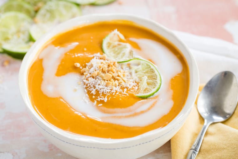 Thai Butternut Squash Soup served in a bowl with soup spoon