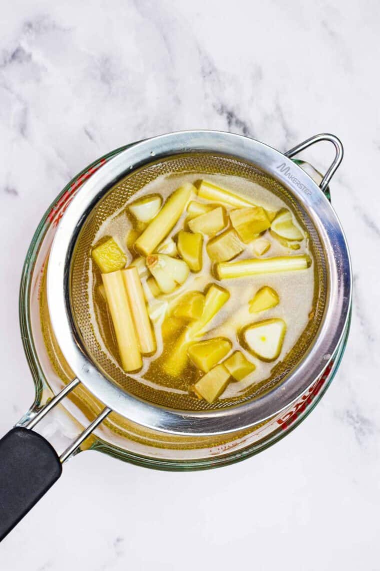 Straining aromatics from broth