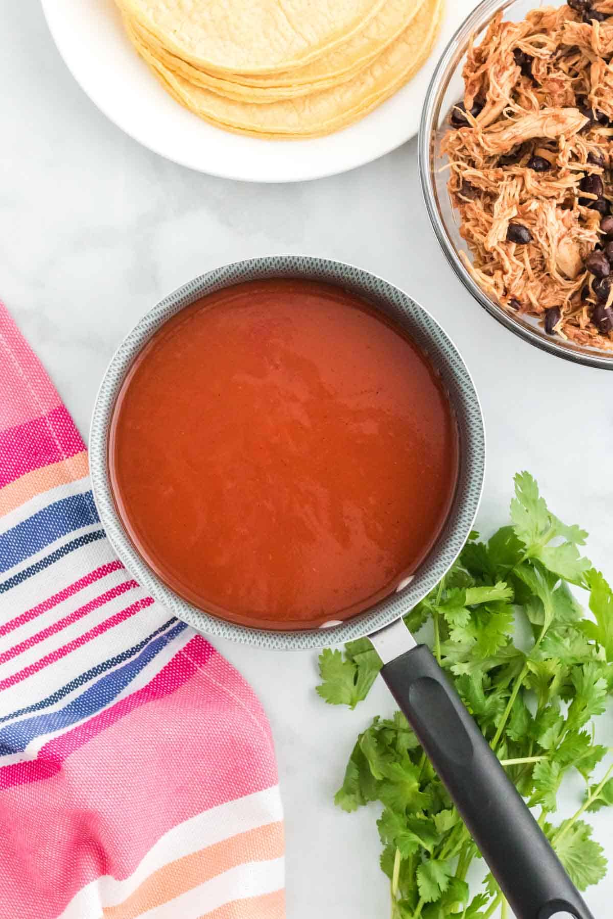 Enchilada sauce in a saucepan.