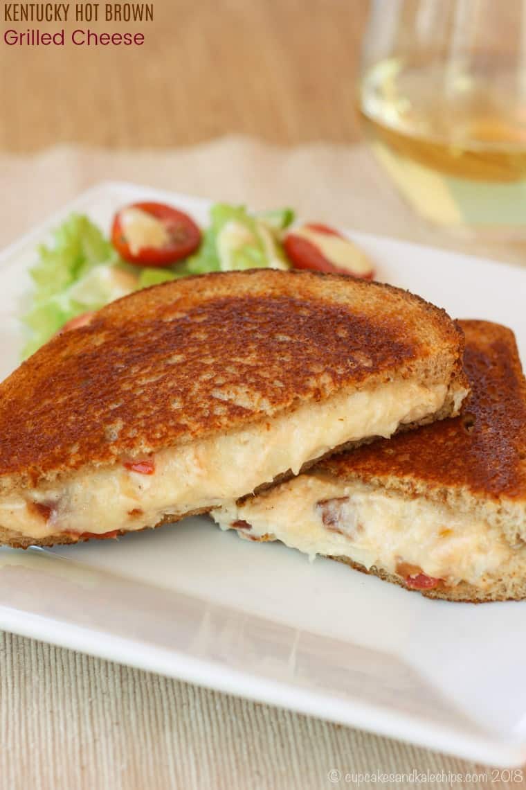 Kentucky Hot Brown Grilled Cheese cut diagonally and stacked on a plate