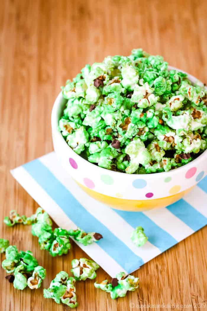 Mint Chocolate Chip Popcorn spilling out of a bowl