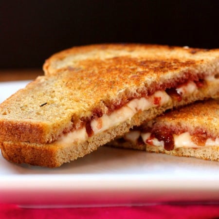 Strawberry Bacon Havarti Grilled Cheese halves on a plate