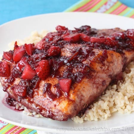 Strawberry Red Wine Glazed Salmon over rice on a plate