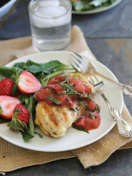 Grilled Chicken with Strawberry Basil Sauce with a Strawberry and Spinach Salad on a plate