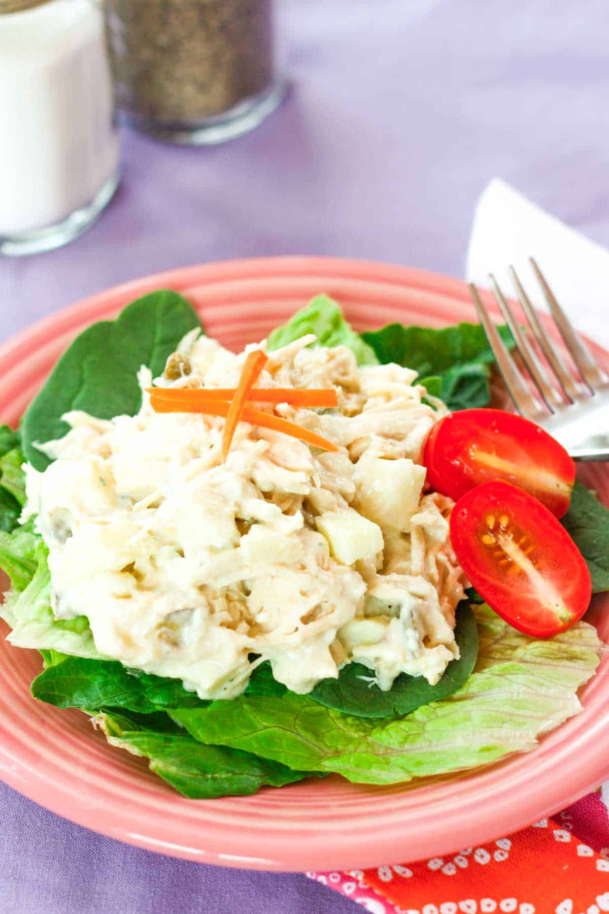 Greek yogurt chicken salad with apples and blue cheese over lettuce