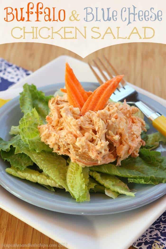 Buffalo Chicken Salad with blue cheese on top of fresh greens.