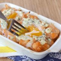 Buffalo cauliflower baked eggs in a casserole dish.