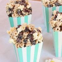 Very Berry Cheerios Popcorn Snack Mix in blue and white striped popcorn bags.