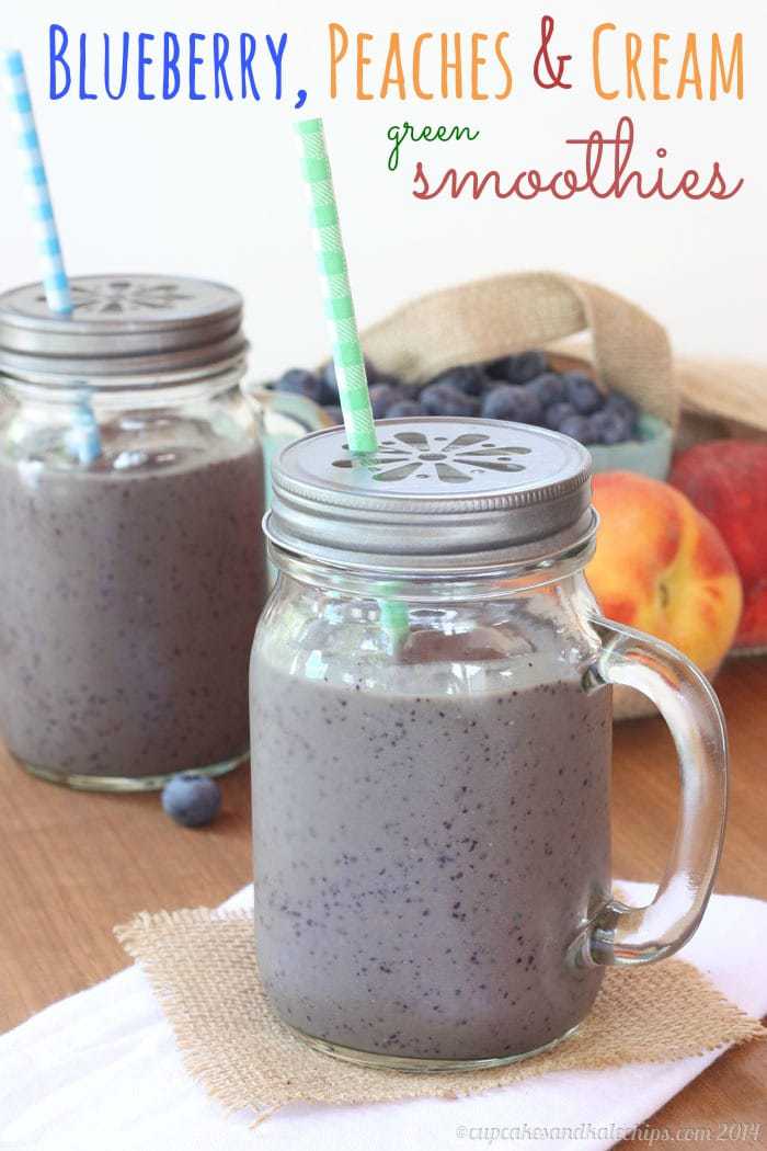 Blueberry and Peach Green Smoothies in sipping cups with straws.