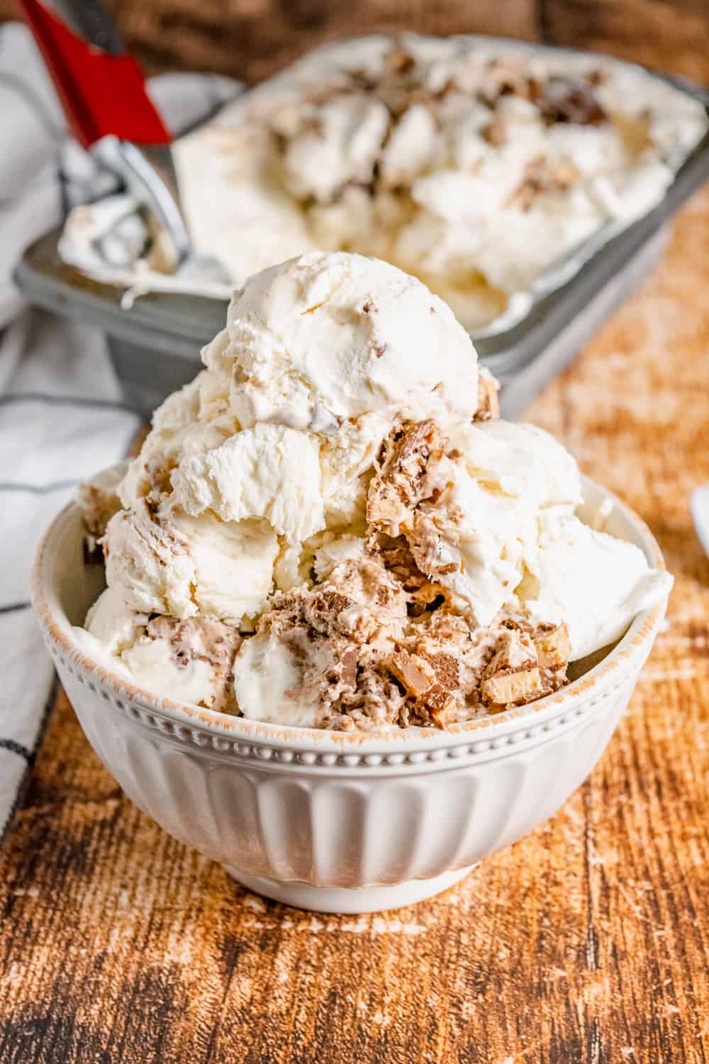 No-Churn Ice Cream with Nutella and Toffee Bits in a large white bowl