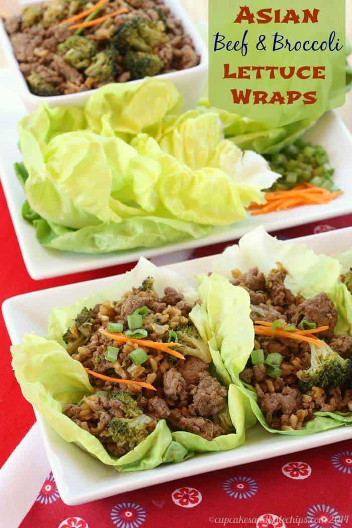Two Asian beef and broccoli lettuce wraps on a rectangular plate with the beef filling and additional lettuce leaves in the background.