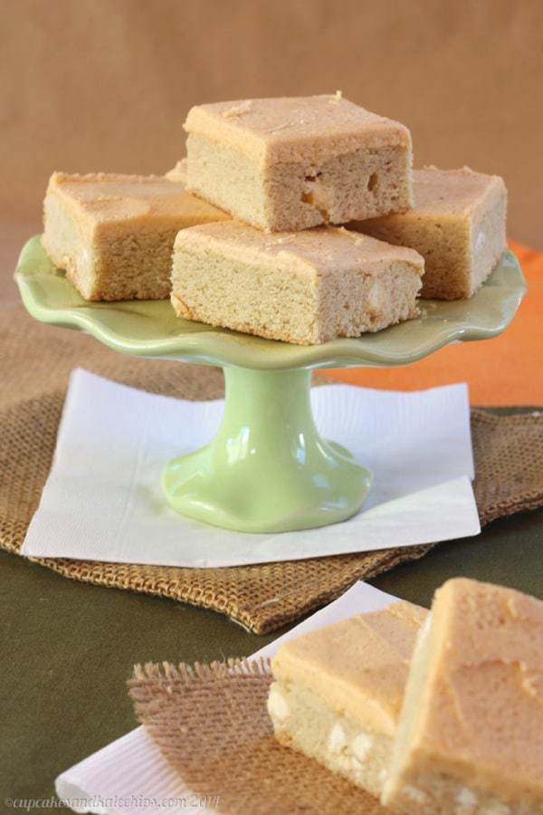 White Chocolate Chip Sugar Cookie Bars arranged on a cake stand