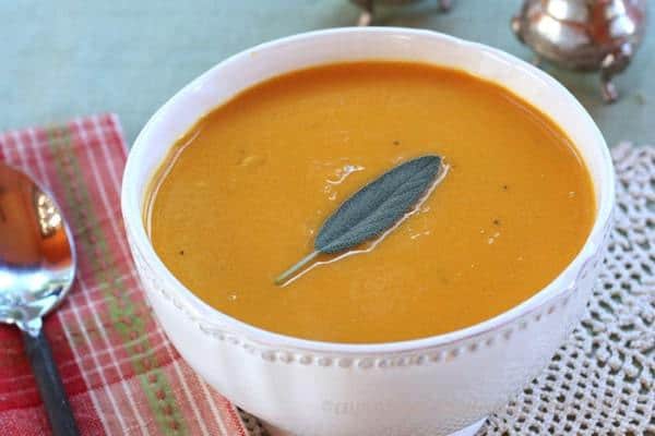 Apple Cider and Cheddar Cheese Butternut Squash Soup with a sage leaf on top