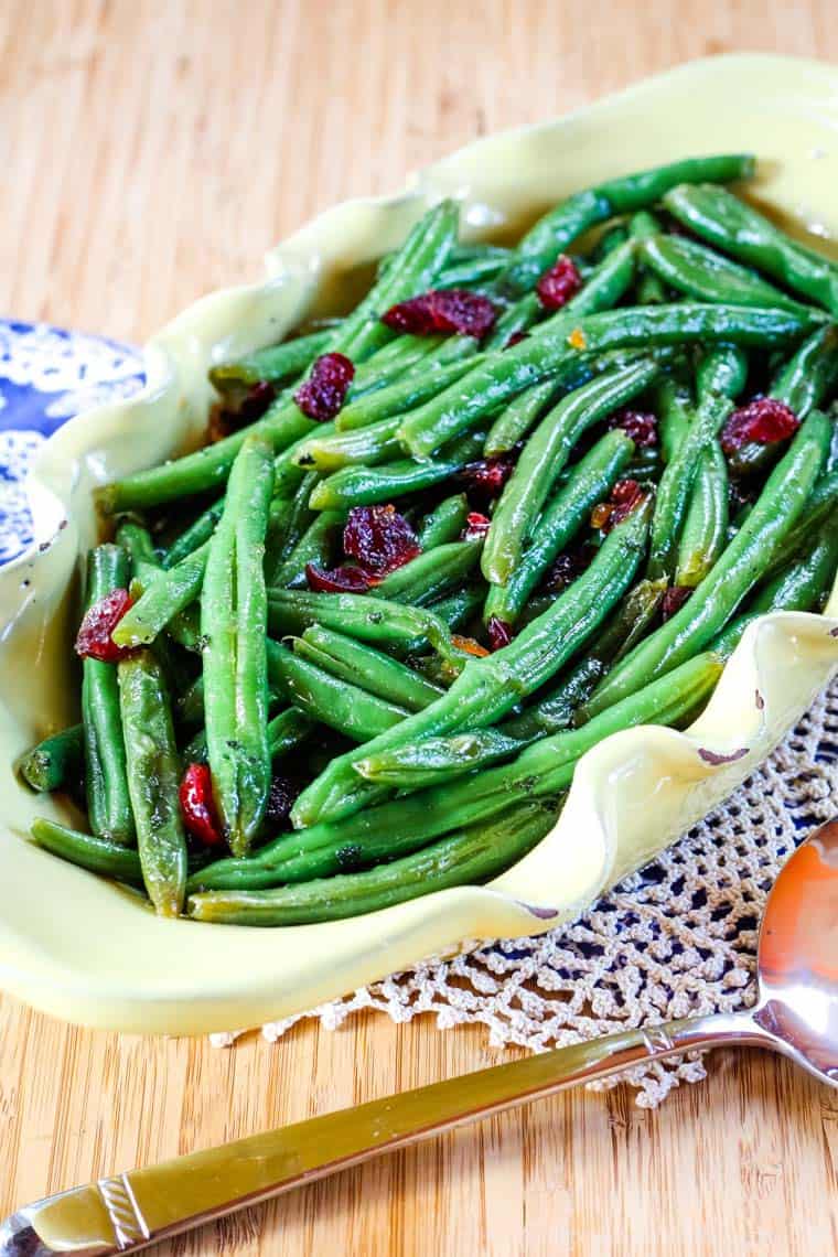 Cranberry Orange Glazed Green Beans with Cranberries in a serving dish.