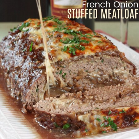 Onions and cheese oozing from inside a stuffed meatloaf